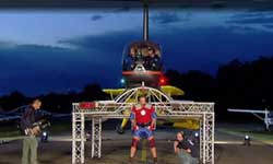 Strongman attempts to lift helicopter on his shoulders Strongman attempts to lift helicopter on his shoulders