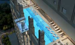 Glass bottomed swimming pool sits 152m above the ground below Glass bottomed swimming pool sits 152m above the ground below