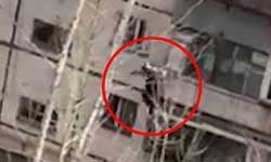 Horrifying moment daredevil plunges four floors after climbing out of a window in a block of flats Horrifying moment daredevil plunges four floors after climbing out of a window in a block of flats