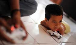 this boy will play vedio game without arms and legs this boy will play vedio game without arms and legs