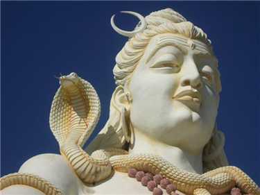 The snake is wrapped around the neck of Lord Shiva, here about ...