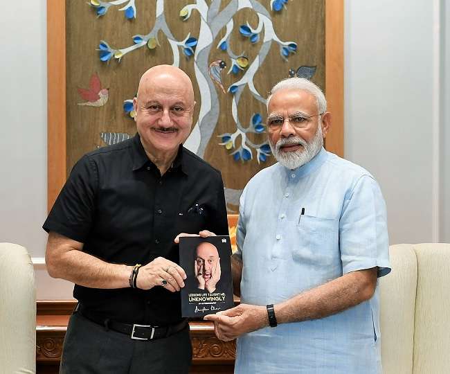 anupam kher Gifts his autobiography Lessons Life Taught Me Unknowingly to  prime minister narendra modi