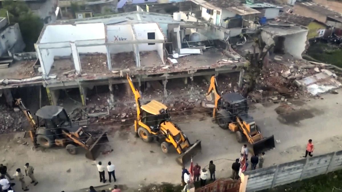 bulldozer action against those who pelted stones during garba event in gandhinagar