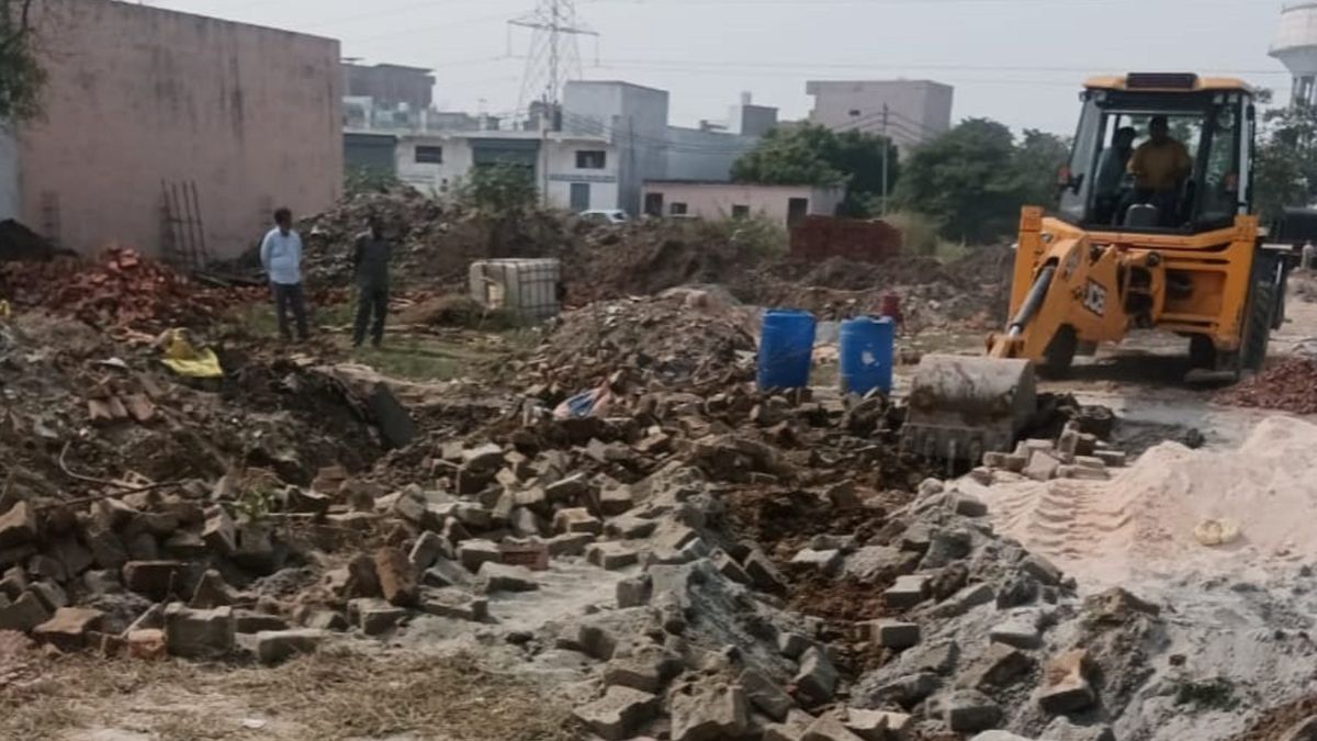 bulldozer action in ghaziabad gda cracks down on illegal construction