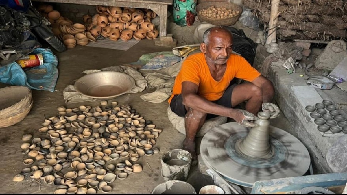 the light of the earthen lamp is lost in the glow of the led