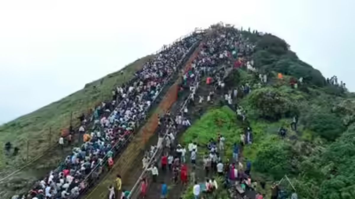 devotees climb deviramma hill for deepavali festival despite rain