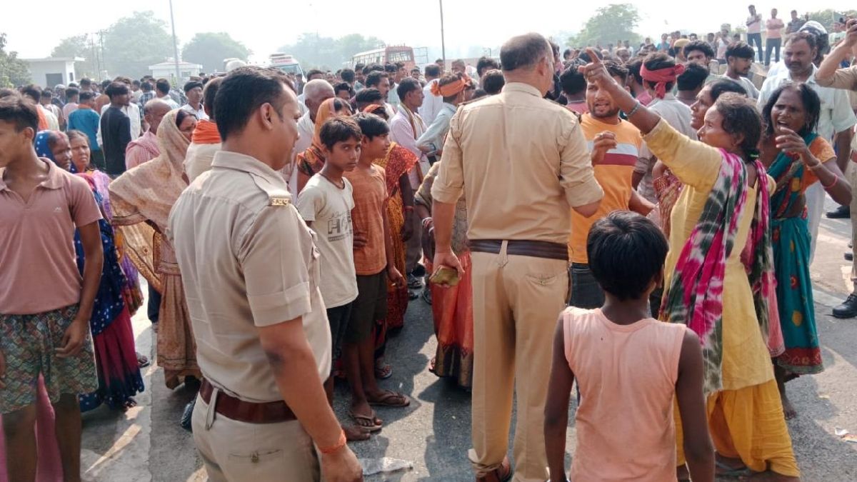 up road accident bus collision kills uncle and nephew locals protest