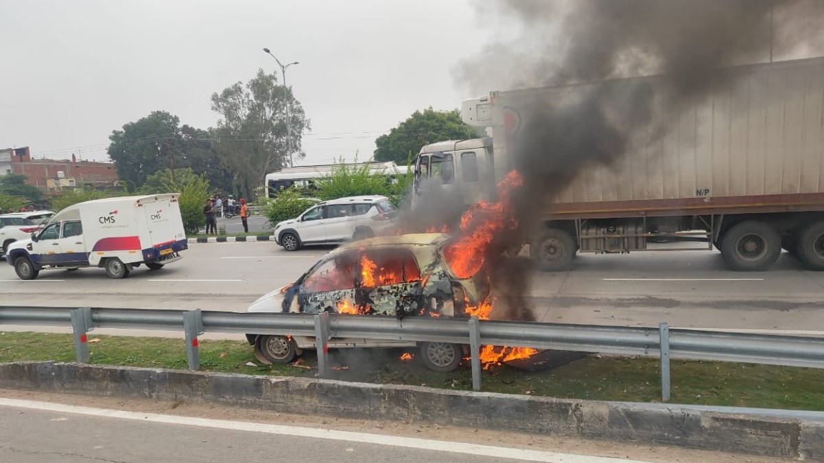 a car travelling from prayagraj to varanasi collided with a divider in bhadohi and caught fire