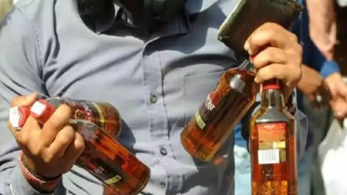 delhi excise team raid employees caught filling cheap liquor in expensive bottles