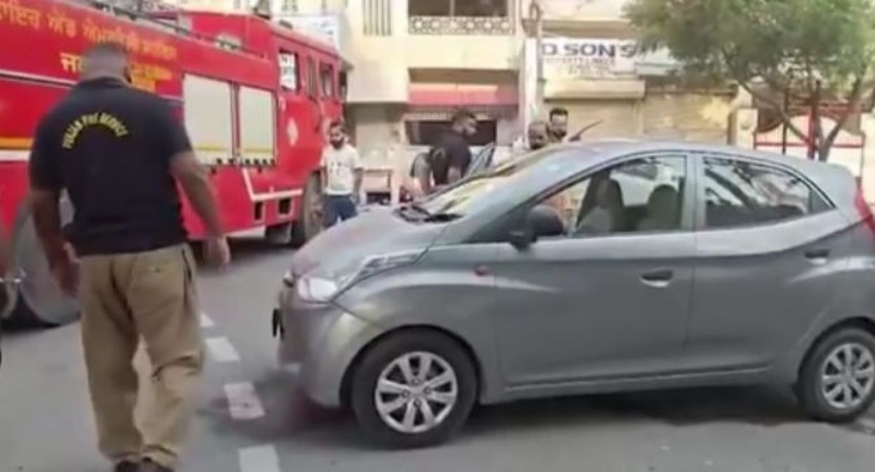 jalandhar running car catches fire elderly couple escapes unhurt