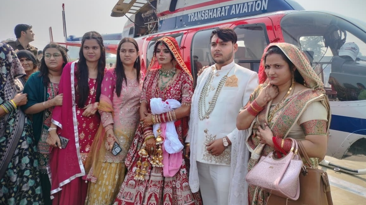 groom arrives by helicopter to marry farmers daughter in dankaur