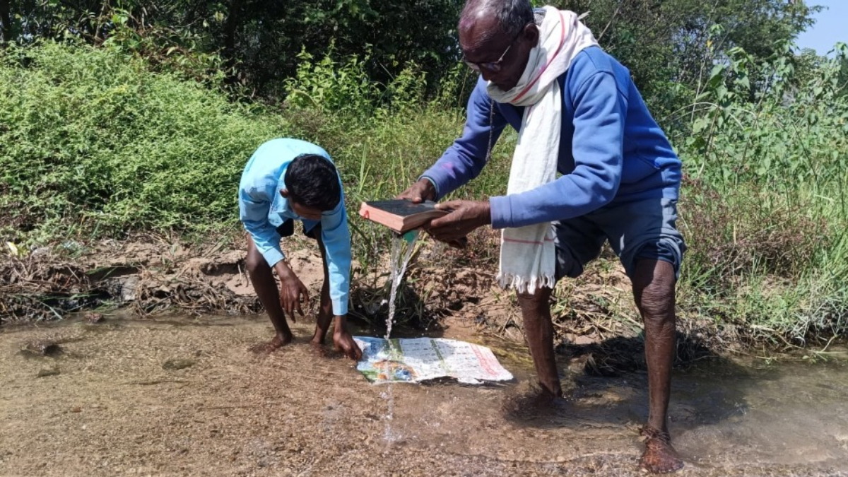 kanker father and son reverts to hinduism discards bible in river