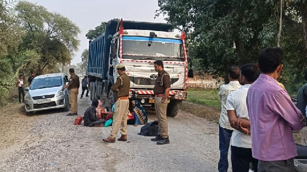 three people riding on a bike a dumper ran over a woman who had fallen