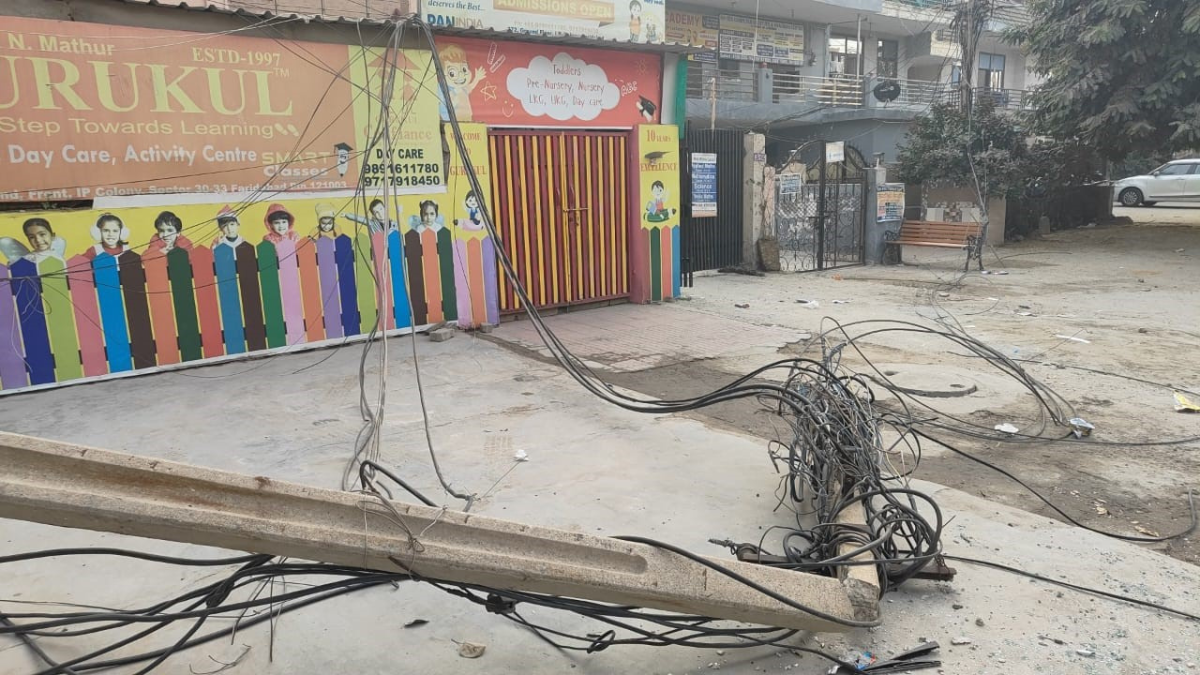 faridabad dilapidated electric pole collapses near play school after truck collision