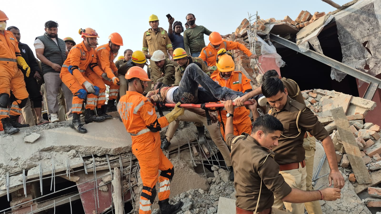 greater noida building collapse fears of trapped workers