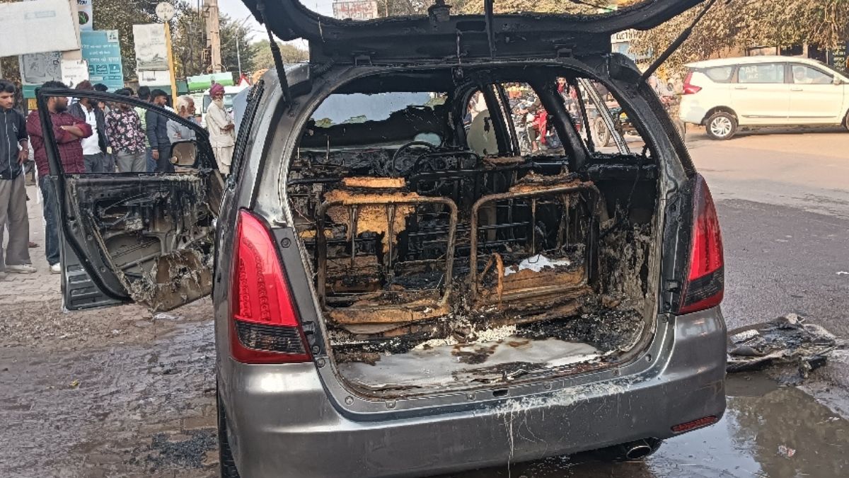 a massive fire suddenly broke out in an innova car parked on the roadside in fatehabad
