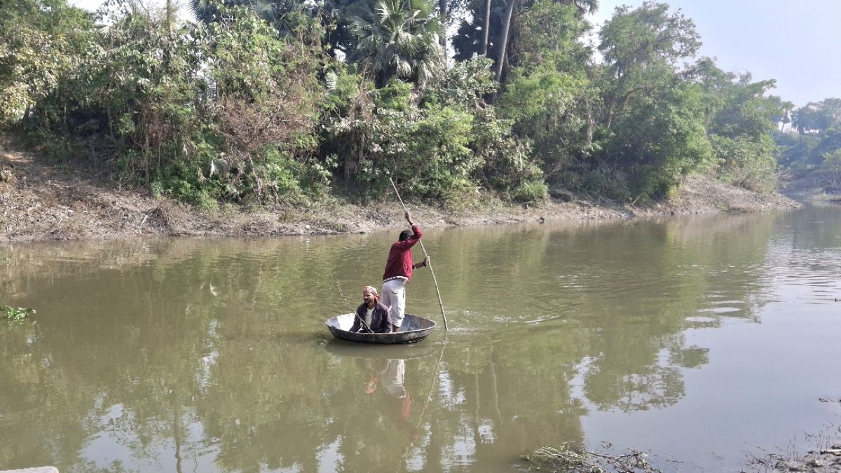 villagers risk lives crossing river in iron pot due to lack of bridge