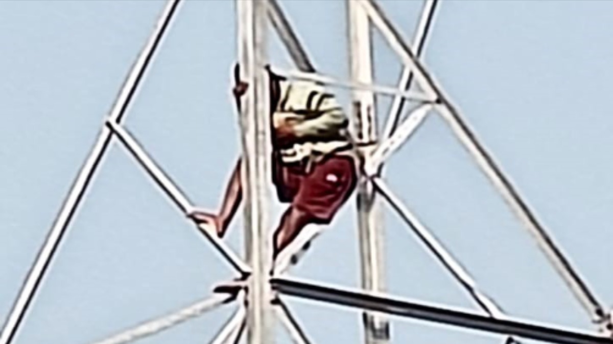 man climbs electric tower after wife leaves for her parents home