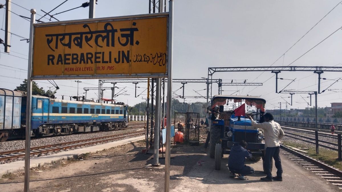 tractor and bikes running on railway platform of raibareilly station and bicycle on footover bridge