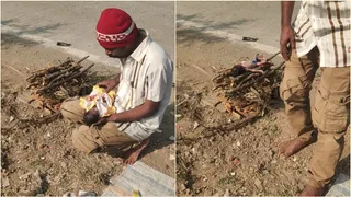 सड़क किनारे लकड़ियों की चिता बनाकर नवजात का अंतिम संस्कार (वीडियो ग्रैब)