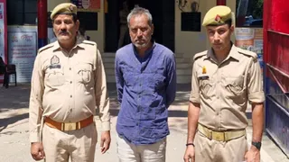 पुलिस की गिरफ्त में पत्नी का हत्या आरोपित पूरण। जागरण