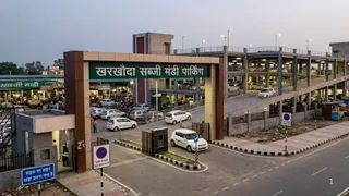 खरखौदा नगरपालिका ने शहर की बढ़ती यातायात समस्या के समाधान हेतु सब्जी मंडी क्षेत्र में पार्किंग विकसित करने का निर्णय लिया है। इमेज एआई