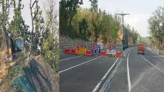 दिल्ली देहरादून इकोनामिक काॅरिडोर पर जेसीबी से कार्य करते कर्मचारी और रूट डाववर्जन के लिये लगाए गये बैरियर। जागरण