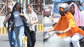 तेज धूप के बीच कपड़ा बना सहारा, चेहरों को ढक कर निकलते लोग