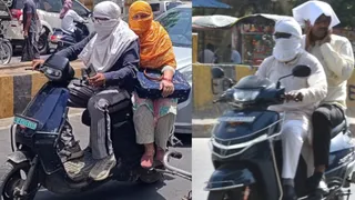 तेज धूप के बीच मुंह पर कपड़ा बांध कर निकलते लोग