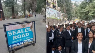 शिमला शहर में सील्ड रोड का लगा बोर्ड और दायें प्रदर्शन करते अधिवक्ता।