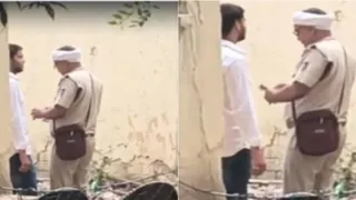 युवक से रकम लेकर गिनते हुए एएसआई। (वीडियो ग्रैब)