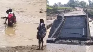 जान जोखिम में डालकर नदी पार करने को मजबूर स्कूली बच्चे।