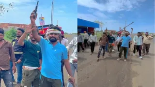 एयरगन-लाठी लहराते हुए युवक (वीडियो ग्रैब)