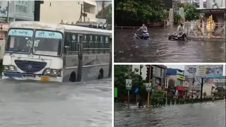 मध्य हरिद्वार के श्री चंद्राचार्य चौक पर जलभराव से गुजरती बस।