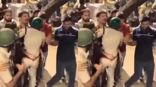बुधवार को संसद मार्ग पर उपद्रवियों के चंगुल से बचाकर सुरक्षित जगह पर ले जाते डीसीपी आईएफएसओ विनीत कुमार और उनकी टीम के कर्मी। (विडियोग्रेब)