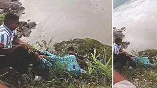 सुजानपुर में ब्यास नदी किनारे गिरी लड़की को रेस्क्यू करते लोग।