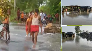 सड़क पर पानी चढ़ने की वजह से आवागमन पूरी तरह बाधित हो गया है। लोग जान जोखिम में डालकर कहीं आ-जा रहे। फोटो: जागरण