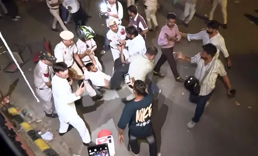 Police detain a protester