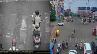 खाकी वर्दी में स्कूटी चलाती नजर आई महिला। (वीडियो ग्रैब)