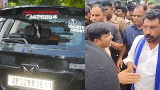पथराव के चलते टूटा गाड़ी का शीशा और पुलिस से बात करते चंद्र शेखर