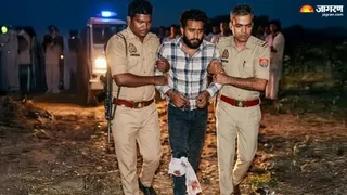 मुठभेड़ के बाद बदमाश सागर सिंह को उठाकर ले जाती धनबाद पुलिस। (फोटो जागरण)