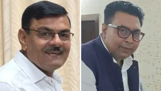 भूषण झा और डा. विमोहन कुमार। फाइल फोटो