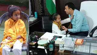 मुरैना एसपी धर्मराज मीना की नाड़ी देखती कृतिका। (फोटो- जागरण)