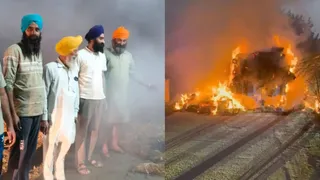नीची बिजली की तारों की चपेट में आई पराली से भरी ट्राली, लगी आग।