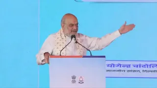 दिल्ली में कार्यक्रम के दौरान सभा को संबोधित करते हुए गृह मंत्री अमित शाह।