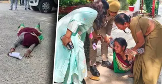 कलेक्ट्रेट परिसर में दंडवत कर न्याय की गुहार लगाने जाती पीड़िता देवरती को उठातीं महिला कर्मी। जागरण
