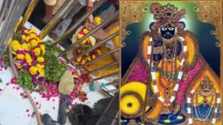 बांकेबिहारी को अर्पित माला गार्डों ने रख दीं जूतों के पास।