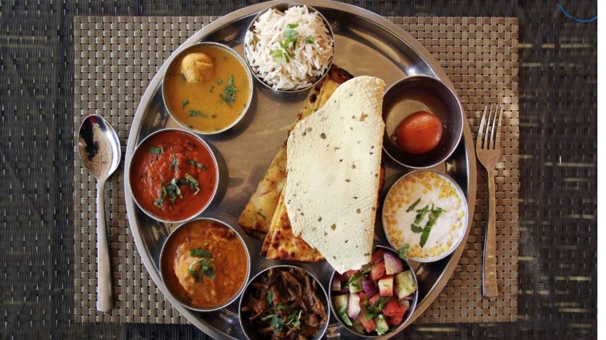 gorakhpur restaurant uproar bone found in veg thali police intervene