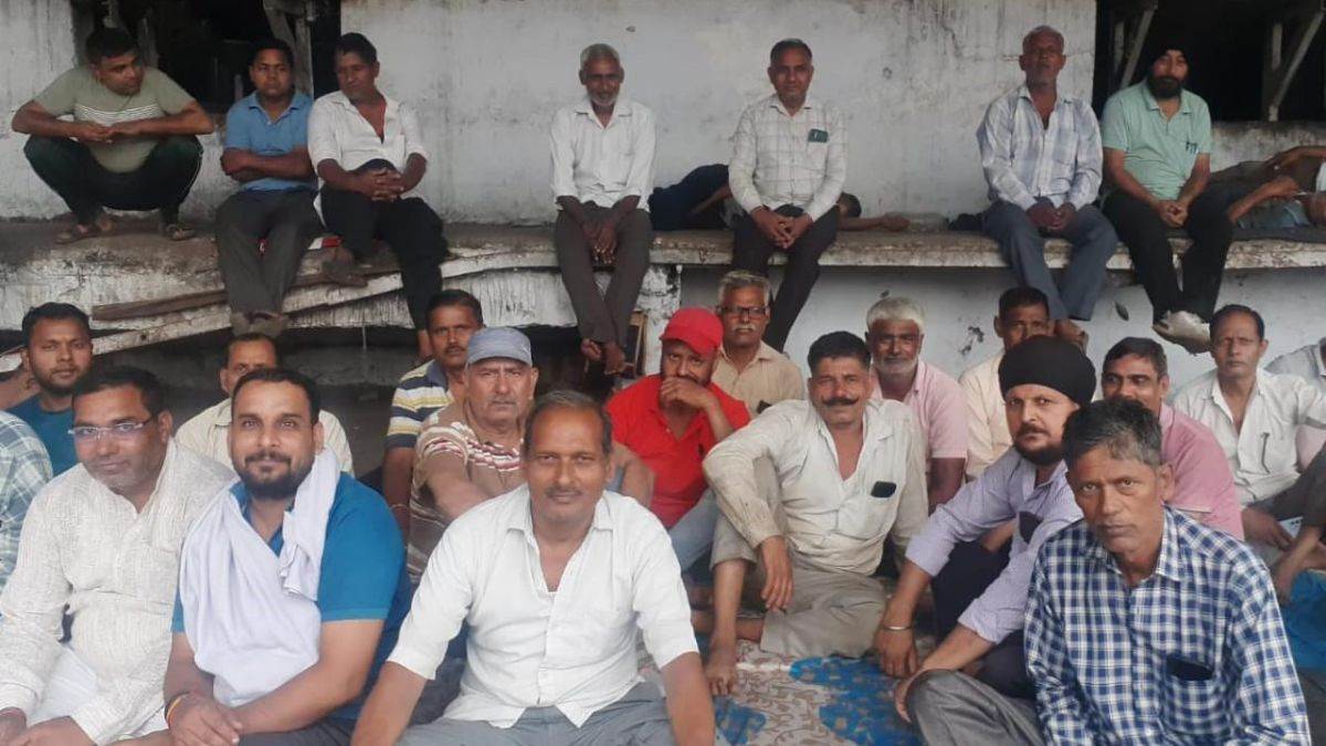 employees strike threat unpaid wages at hapur mill