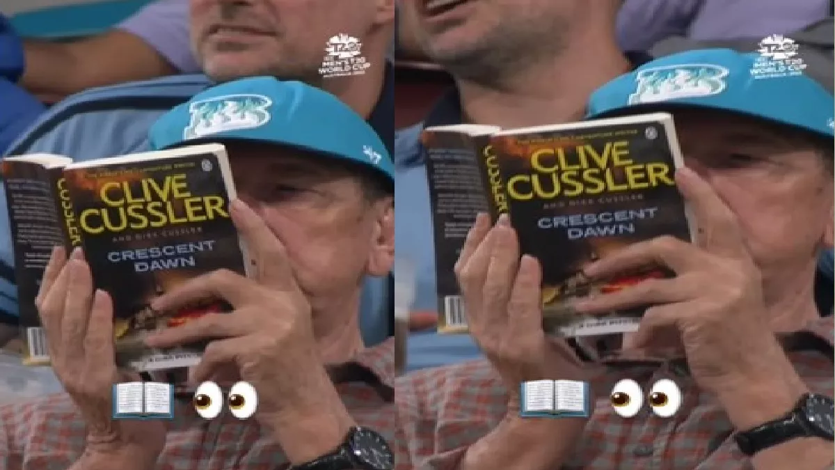 इंग्लैंड और न्यूजीलैंड मैच के दैरान किताब पढ़ते नजर आए एक दर्शक।(फोटो सोर्स: ट्विटर)